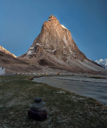 Stunning view of a towering mountain peak in Zanskar Valley, Ladakh, during twilight.